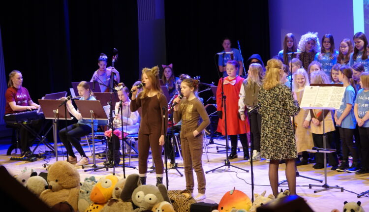 Children are singing at the concert.