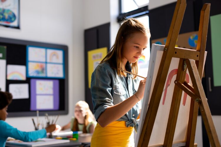 A girl painting a picture.