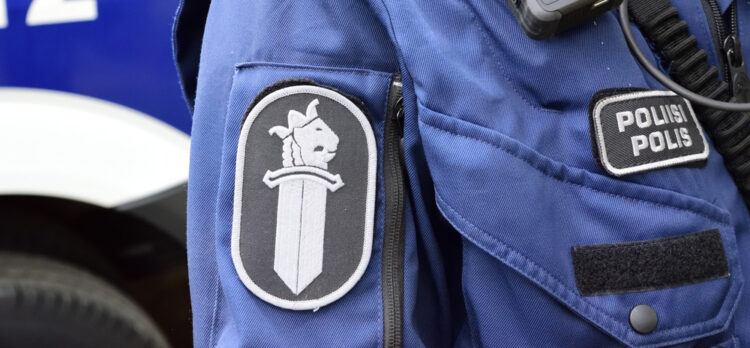 A close-up shot of a police uniform.