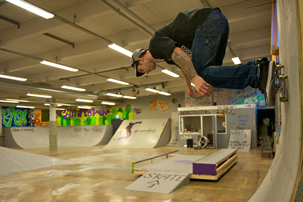 Skater skating in a skate park.