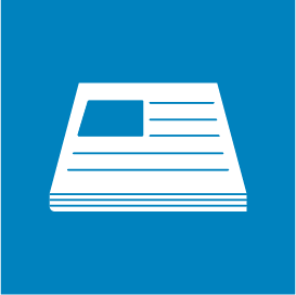 The image is a paper pictogram. It is on a blue background and shows a pile of office paper.